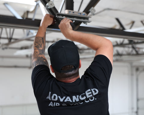 An Advanced Air and Vacuum technician installing compressed air system