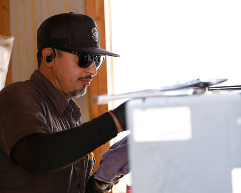 Advanced Air & Vacuum service technician doing regular maintenance on air compressor