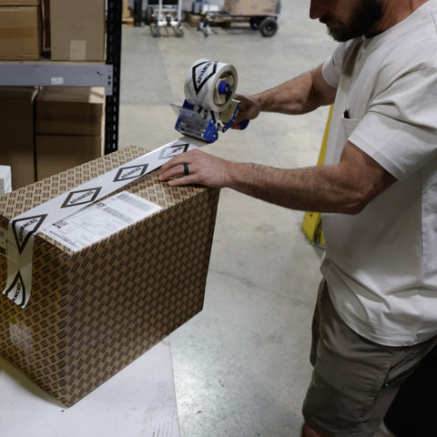 Air compressor parts order being packed for pickup or shipping from Advanced Air & Vacuum in San Diego.