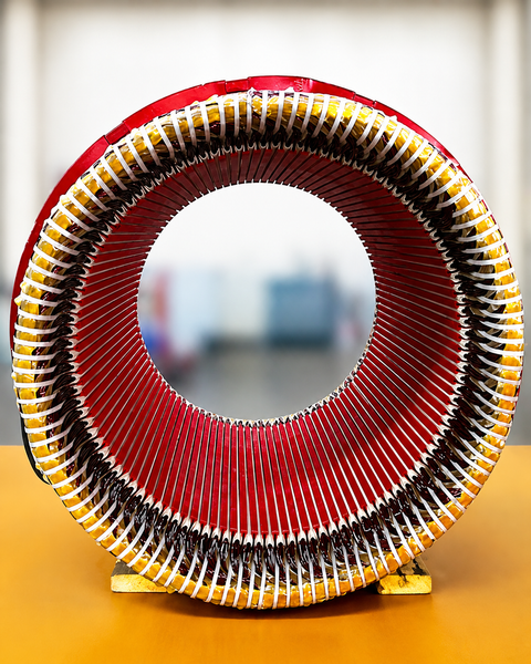After - Electric motor stator winding repair with finished copper windings prepared for industrial motor rebuild.