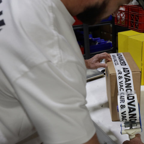 Air compressor parts being packed for customer pickup or shipping from Advanced Air & Vacuum.