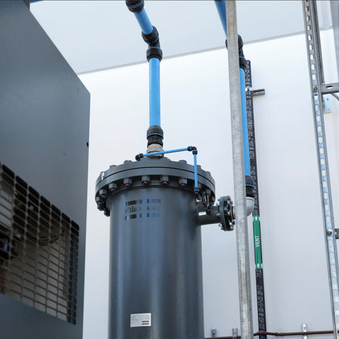 Atlas Copco compressed air treatment system installed with filtration and piping connections
