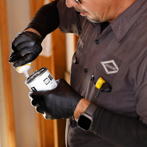 Technician servicing industrial compressed air system equipment