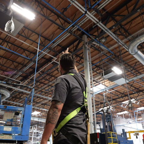 Technician inspecting newly installed industrial air compressor system
