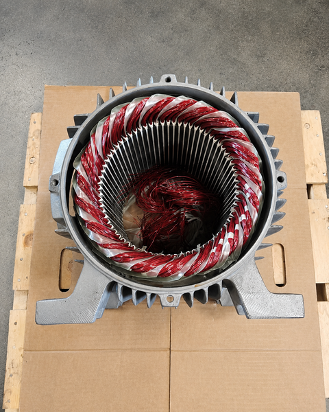 Industrial electric motor stator rewind with red copper windings at Advanced Air & Vacuum motor shop.