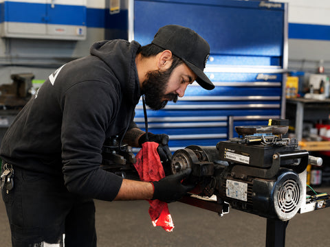 Advanced Air & Vacuum technician servicing a Pro-Cut brake lathe for automotive repair shop equipment support in El Cajon, CA.
